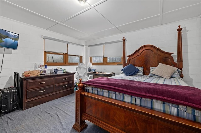 bedroom with concrete block wall