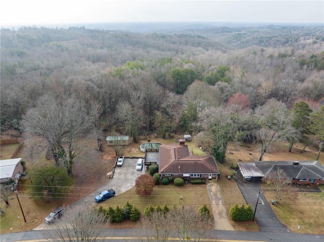 bird's eye view featuring a forest view