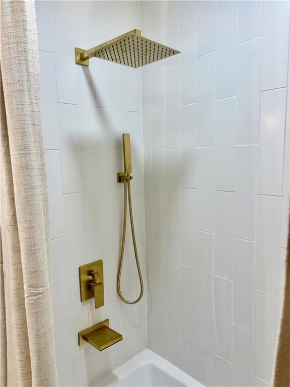 bathroom featuring curtained shower