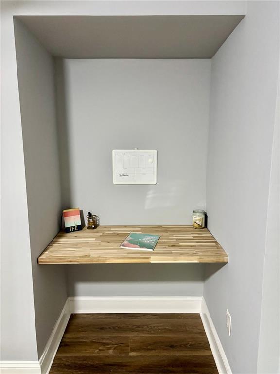 detailed view of wood finished floors and baseboards