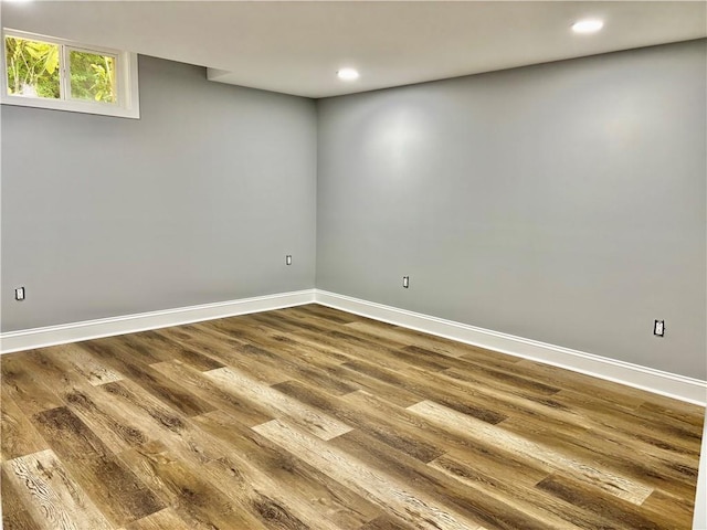 basement with dark wood-style flooring, recessed lighting, and baseboards
