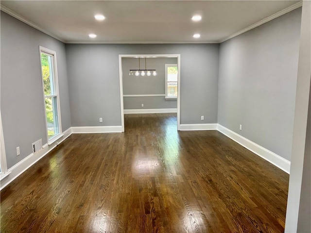 unfurnished room featuring ornamental molding, dark wood-style floors, recessed lighting, and baseboards