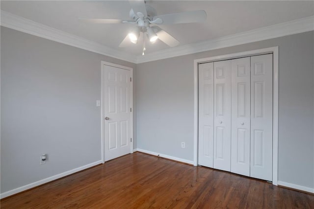 2157 Brandon Lee Dr SW, Marietta, GA 30008 - unfurnished bedroom featuring wood finished floors, baseboards, ornamental molding, a closet, and a ceiling fan