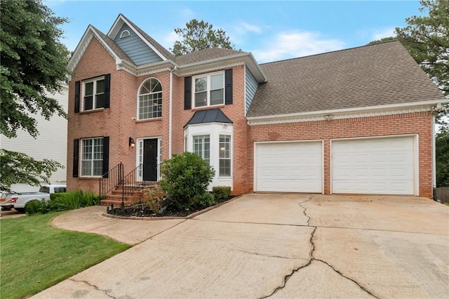 2157 Brandon Lee Dr SW, Marietta, GA 30008 - view of front of property with brick siding, an attached garage, concrete driveway, and a shingled roof