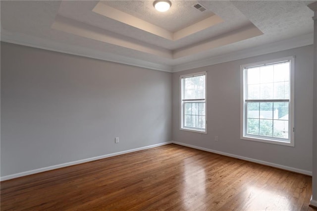 2157 Brandon Lee Dr SW, Marietta, GA 30008 - unfurnished room featuring a raised ceiling, wood finished floors, baseboards, and a textured ceiling