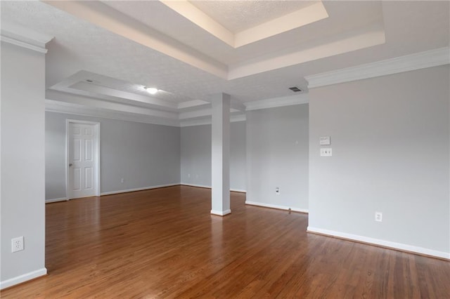 2157 Brandon Lee Dr SW, Marietta, GA 30008 - unfurnished room with a raised ceiling, baseboards, wood finished floors, and ornamental molding