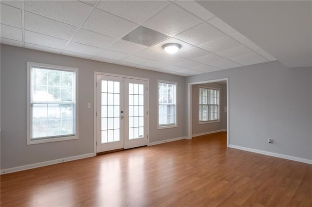 2157 Brandon Lee Dr SW, Marietta, GA 30008 - spare room with a paneled ceiling, light wood finished floors, plenty of natural light, and french doors