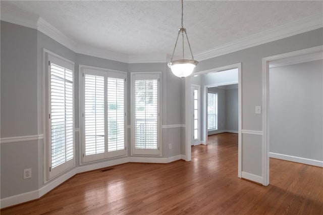 2157 Brandon Lee Dr SW, Marietta, GA 30008 - unfurnished dining area with a textured ceiling, wood finished floors, baseboards, and ornamental molding