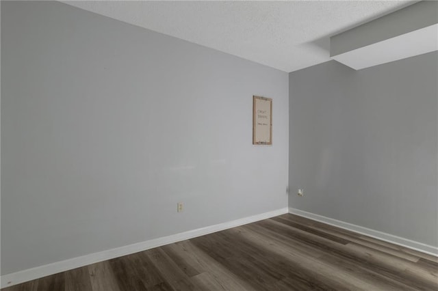 2157 Brandon Lee Dr SW, Marietta, GA 30008 - unfurnished room featuring dark wood finished floors, baseboards, and a textured ceiling