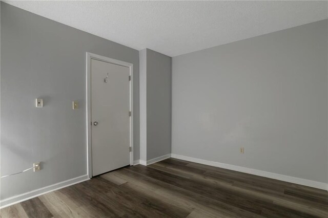 2157 Brandon Lee Dr SW, Marietta, GA 30008 - spare room featuring dark wood finished floors, baseboards, and a textured ceiling