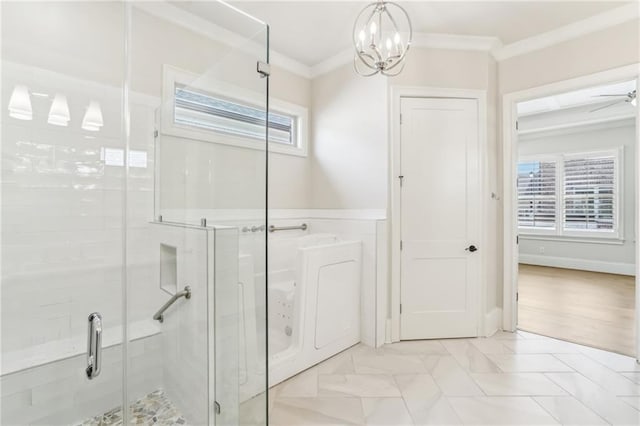 bathroom with ornamental molding and a stall shower