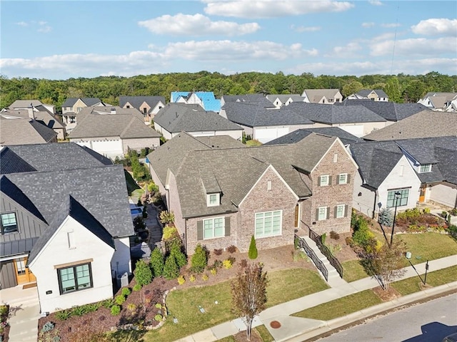 birds eye view of property with a residential view