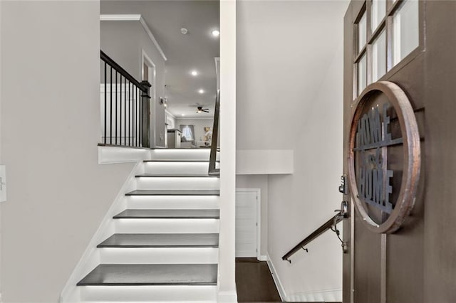 interior space featuring stairway, baseboards, crown molding, and recessed lighting