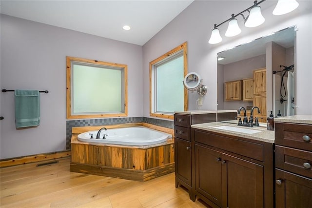 102 Waleska Ln, Ellijay, GA 30540 - full bath featuring wood finished floors, a garden tub, and vanity