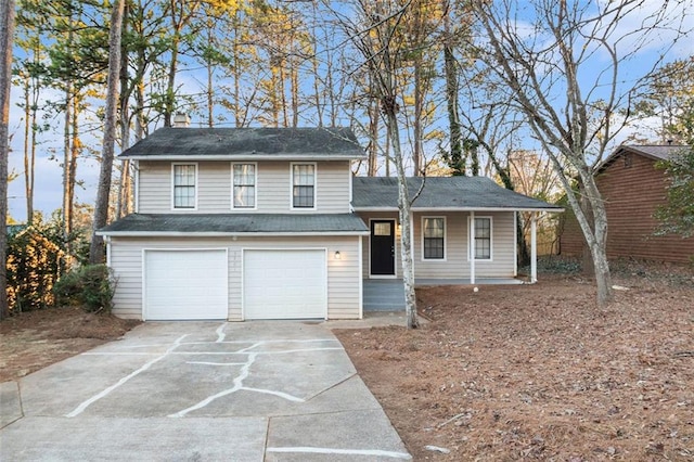 view of front of home with covered porch and a garage