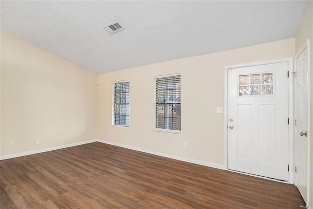 entrance foyer with dark hardwood / wood-style flooring