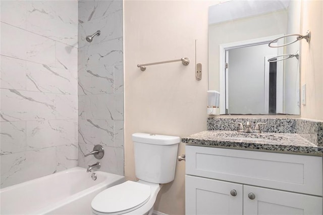 full bathroom featuring vanity, toilet, and tiled shower / bath