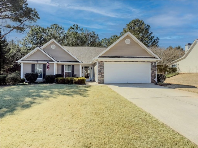 single story home with an attached garage, stone siding, concrete driveway, and a front yard