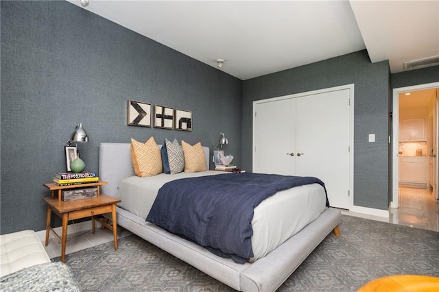 145 15th St NE Unit 1225, Atlanta, GA 30309 - bedroom with tile patterned flooring and a closet