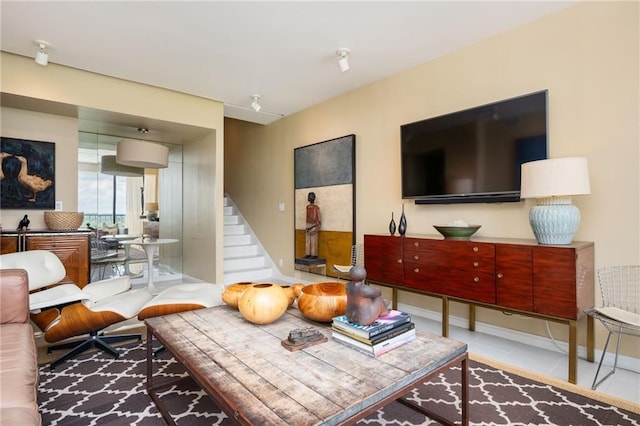 145 15th St NE Unit 1225, Atlanta, GA 30309 - living room with stairs, tile patterned floors, and baseboards