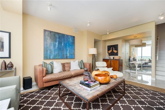 145 15th St NE Unit 1225, Atlanta, GA 30309 - living room featuring baseboards