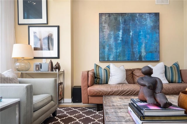 145 15th St NE Unit 1225, Atlanta, GA 30309 - living room featuring baseboards and wood finished floors