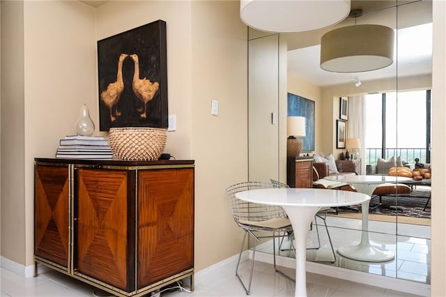 145 15th St NE Unit 1225, Atlanta, GA 30309 - dining space with baseboards