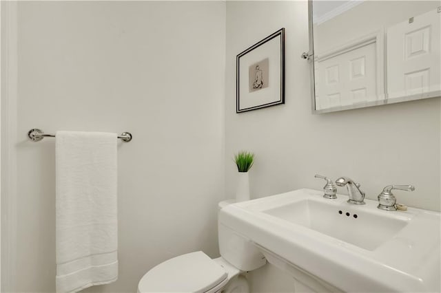 bathroom featuring sink and toilet