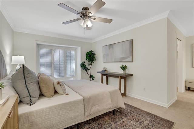 bedroom with crown molding, light colored carpet, and ceiling fan