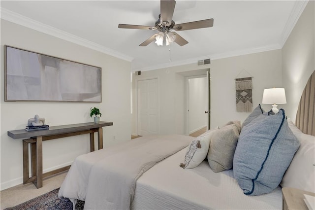 carpeted bedroom with crown molding and ceiling fan