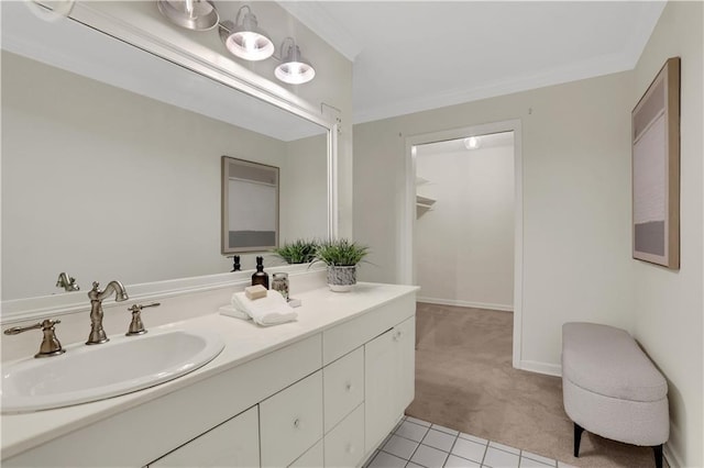 bathroom with crown molding, vanity, and tile patterned flooring