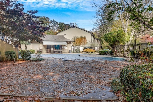 back of property featuring a patio