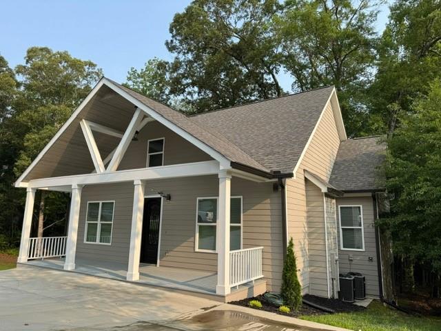 1713 Cagle Ct, Lawrenceville, GA 30045 - view of front of house featuring a porch and a shingled roof