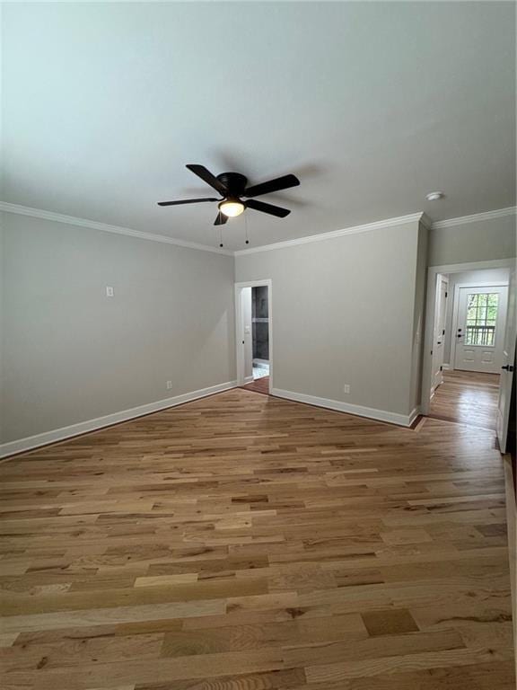 1713 Cagle Ct, Lawrenceville, GA 30045 - unfurnished room with baseboards, ceiling fan, light wood-type flooring, and crown molding