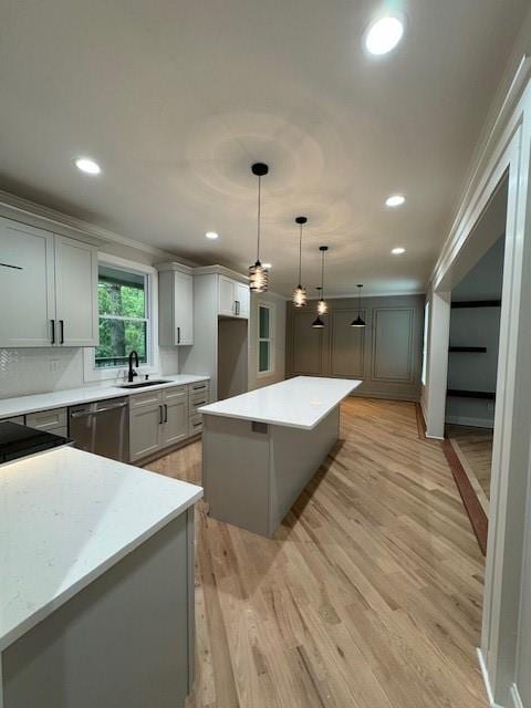 1713 Cagle Ct, Lawrenceville, GA 30045 - kitchen featuring stainless steel dishwasher, a sink, light wood-type flooring, recessed lighting, and a kitchen island