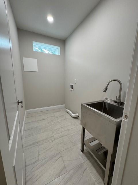 1713 Cagle Ct, Lawrenceville, GA 30045 - laundry area featuring light marble finish flooring, hookup for a washing machine, and baseboards
