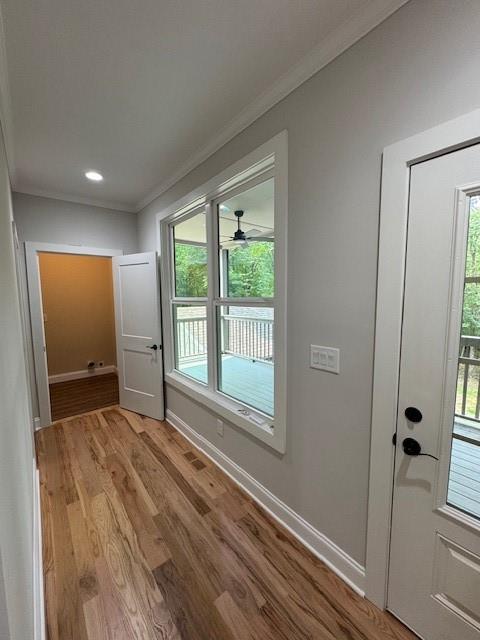1713 Cagle Ct, Lawrenceville, GA 30045 - doorway with crown molding, plenty of natural light, baseboards, wood finished floors, and recessed lighting