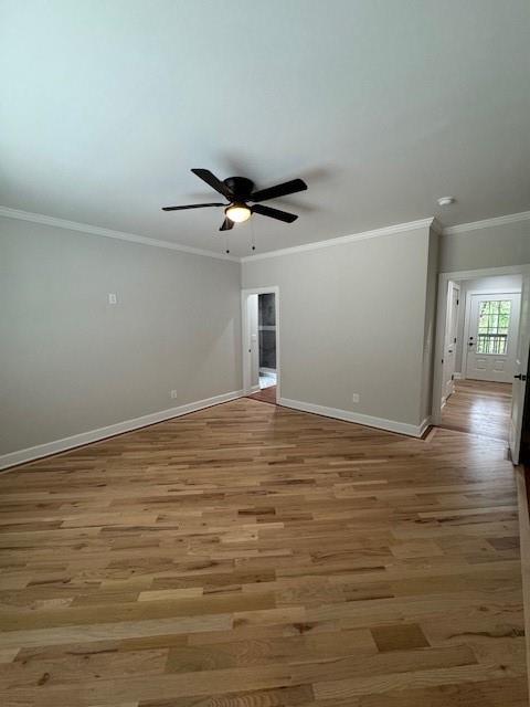 1713 Cagle Ct, Lawrenceville, GA 30045 - spare room with baseboards, light wood finished floors, ceiling fan, and crown molding