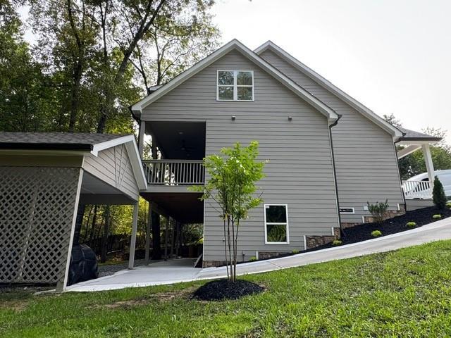 1713 Cagle Ct, Lawrenceville, GA 30045 - rear view of property with a lawn, a carport, and a patio