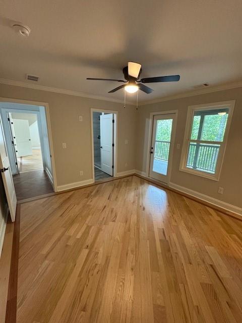 1713 Cagle Ct, Lawrenceville, GA 30045 - spare room featuring light wood finished floors, ornamental molding, baseboards, ceiling fan, and a smoke detector