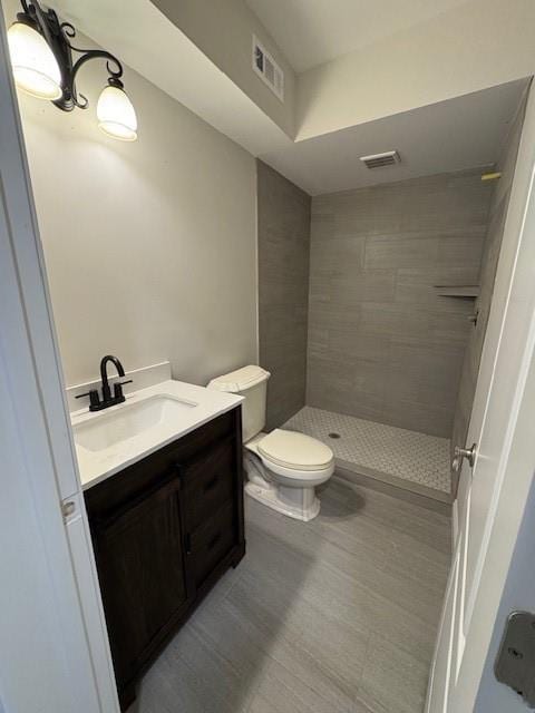 1713 Cagle Ct, Lawrenceville, GA 30045 - full bathroom featuring vanity, a shower stall, and toilet