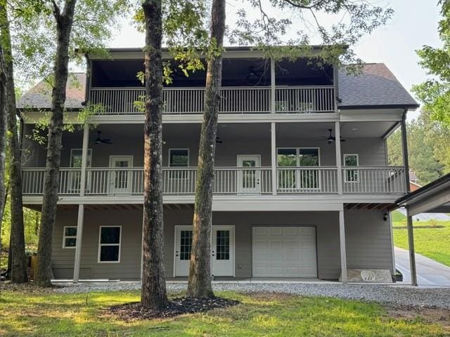 1713 Cagle Ct, Lawrenceville, GA 30045 - rear view of house featuring a balcony, a ceiling fan, and an attached garage