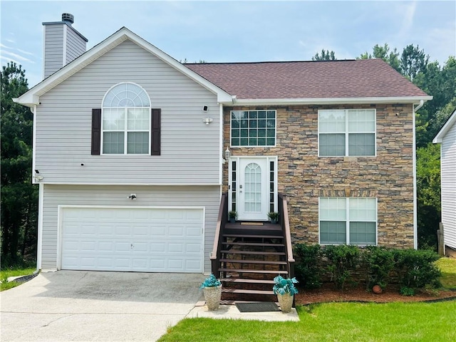 split foyer home featuring a garage