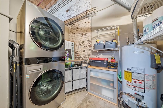 washroom featuring stacked washer and dryer and gas water heater