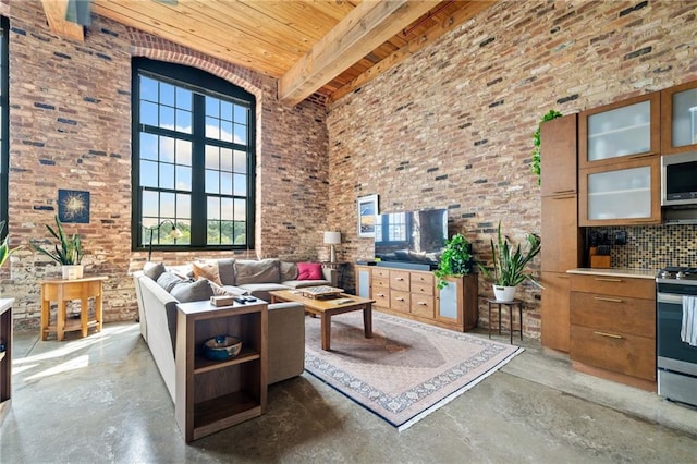 living room with a towering ceiling, wood ceiling, and beam ceiling