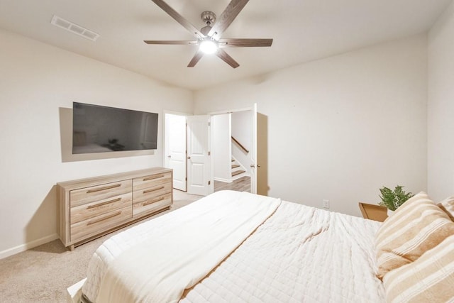 bedroom with light carpet and ceiling fan