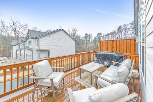 wooden deck with grilling area