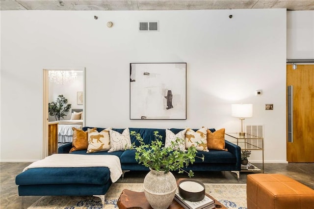 living room featuring baseboards and visible vents