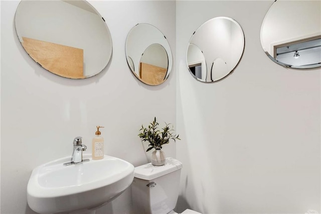 bathroom with a sink and toilet