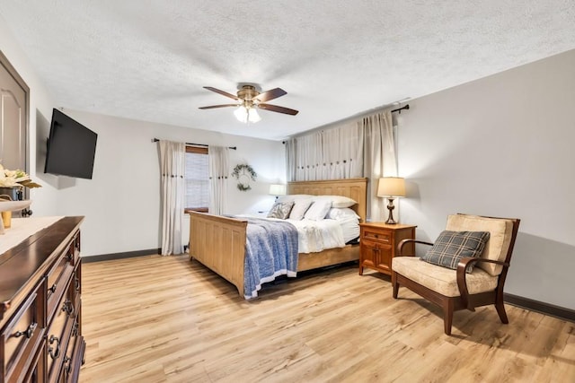 6127 Yellow Creek Rd, Murrayville, GA 30564 - bedroom with a textured ceiling, light wood-style floors, baseboards, and ceiling fan